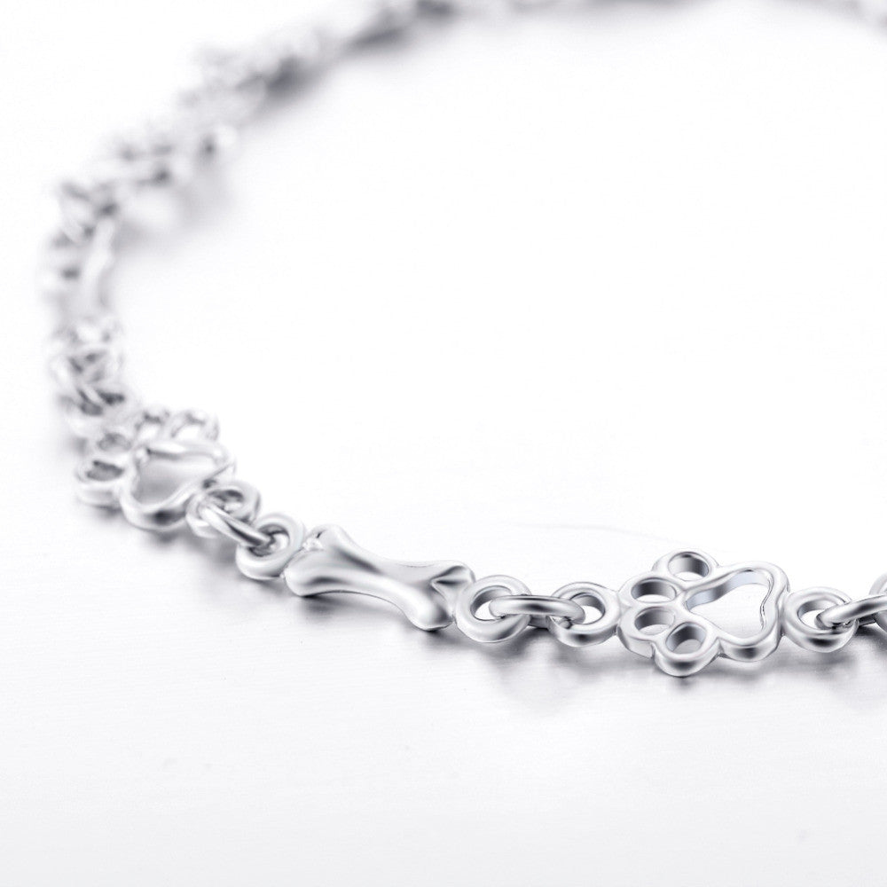 SILVER DOG PAW AND BONE CHARMS BRACELET